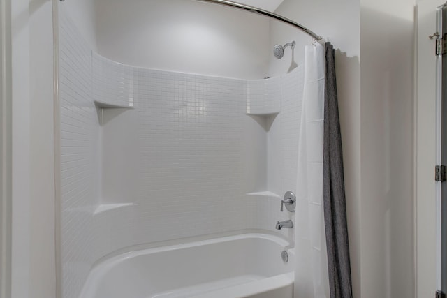 bathroom featuring shower / bath combo with shower curtain