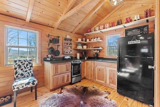 kitchen featuring black appliances, light hardwood / wood-style floors, wood ceiling, and wooden walls