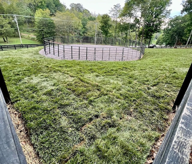 view of yard with a rural view