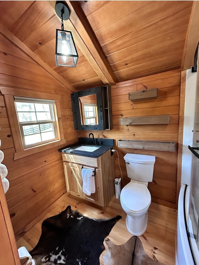 bathroom with vaulted ceiling with beams, wooden walls, wood ceiling, and wood-type flooring