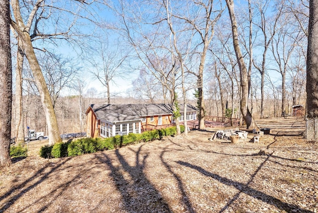 back of property with a wooden deck