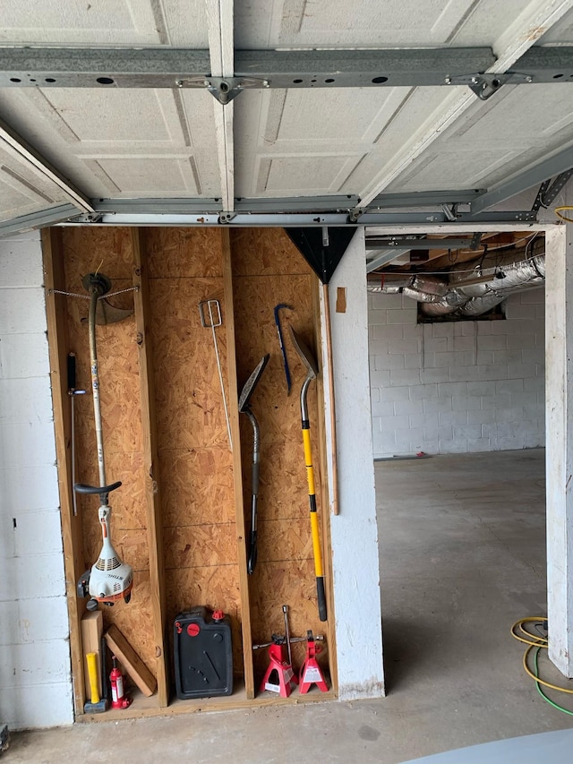 garage with concrete block wall