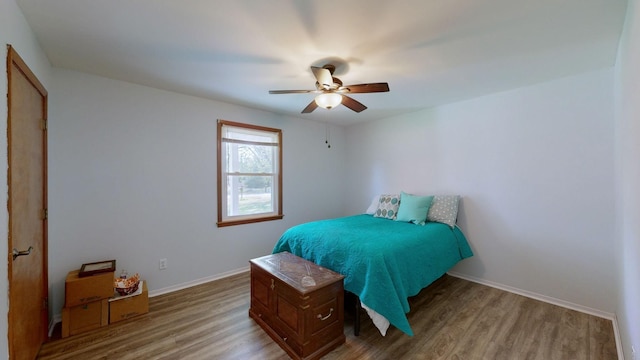 bedroom featuring light wood-type flooring and ceiling fan