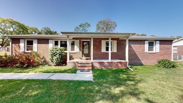 view of front facade with covered porch and a front lawn