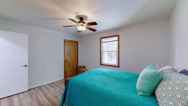 bedroom featuring light wood-type flooring and ceiling fan