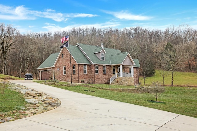 view of front facade with a garage and a front yard