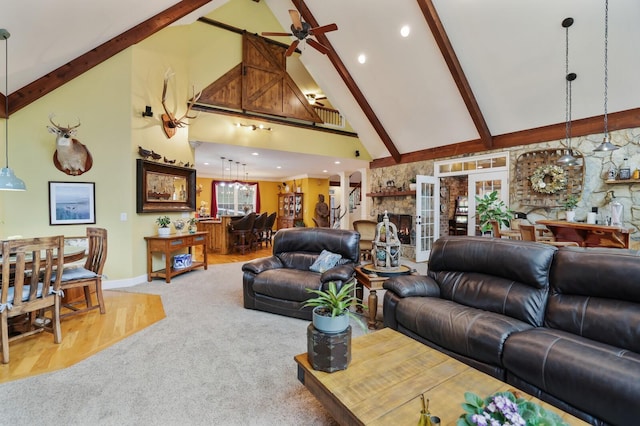 living room featuring ceiling fan, beam ceiling, carpet floors, and high vaulted ceiling