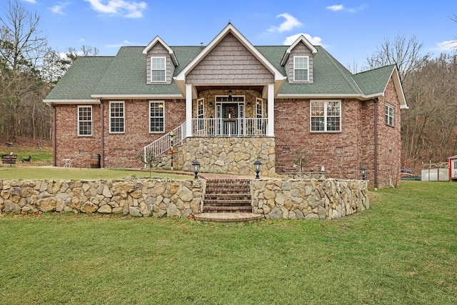 view of front facade with a porch and a front yard