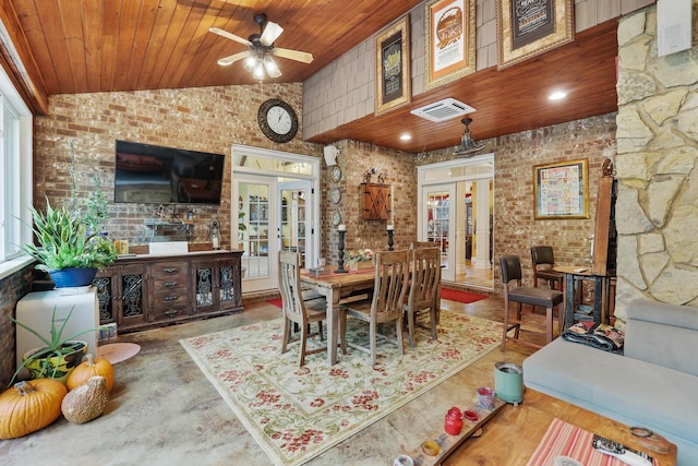 dining space featuring ceiling fan, french doors, wooden ceiling, concrete flooring, and vaulted ceiling