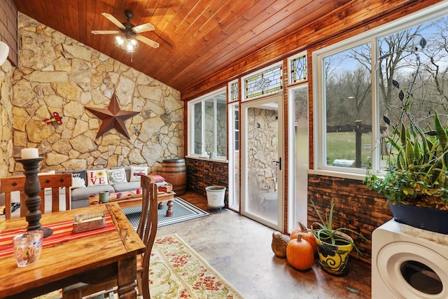 sunroom / solarium with lofted ceiling, plenty of natural light, and wooden ceiling