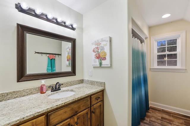 bathroom with vanity and wood-type flooring