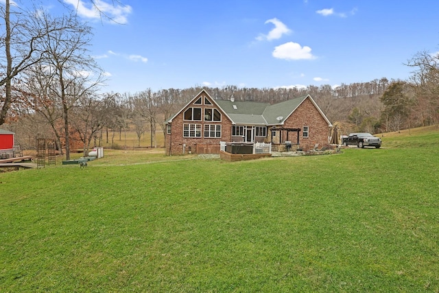 rear view of property with a lawn