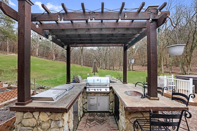 view of patio / terrace featuring a pergola, an outdoor bar, grilling area, and exterior kitchen