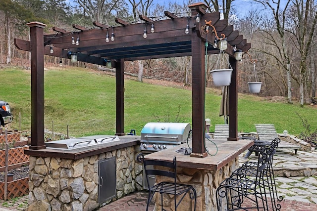 view of patio with exterior bar, an outdoor kitchen, grilling area, and a pergola