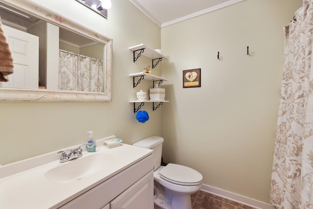 bathroom featuring vanity, toilet, and crown molding