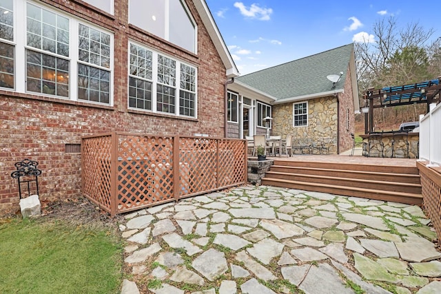 rear view of house with a patio and a deck