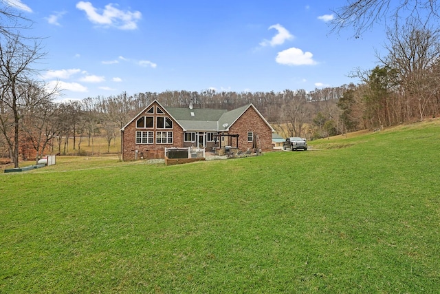 rear view of property with a patio area and a yard