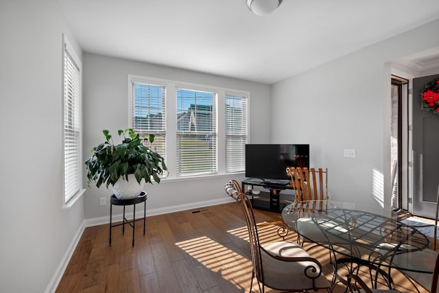 home office featuring hardwood / wood-style floors and a healthy amount of sunlight