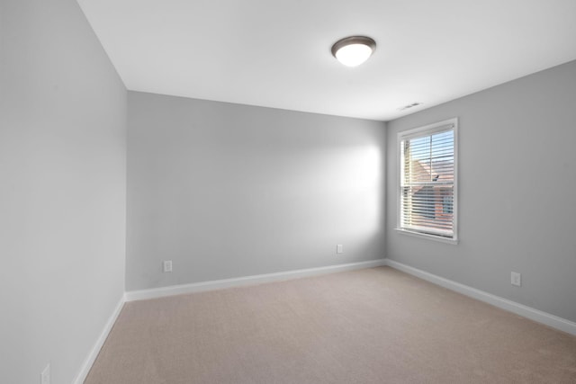 unfurnished room featuring carpet