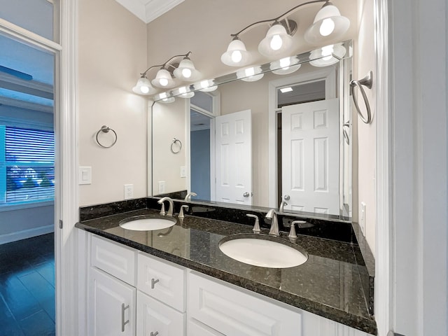 bathroom featuring vanity and ornamental molding