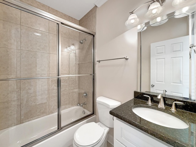 full bathroom featuring shower / bath combination with glass door, vanity, and toilet