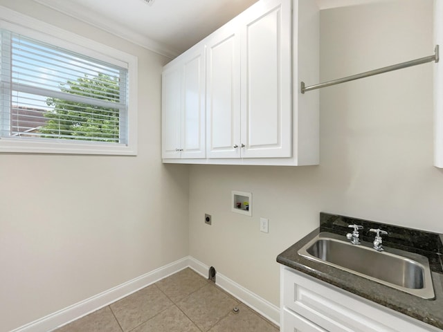 clothes washing area featuring a sink, cabinet space, hookup for an electric dryer, washer hookup, and baseboards