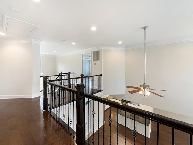 hall featuring crown molding, attic access, an upstairs landing, and wood finished floors