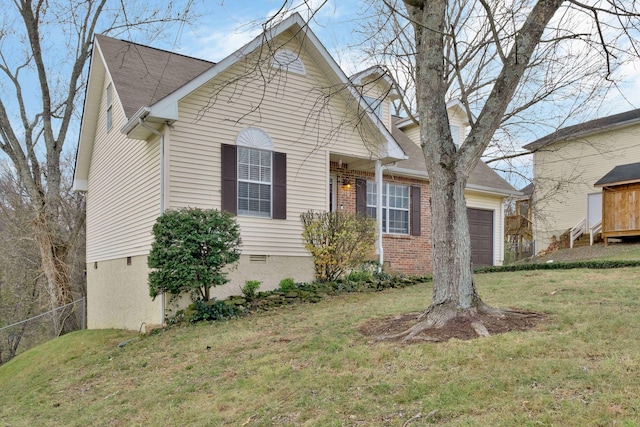 view of front facade with a garage and a front lawn