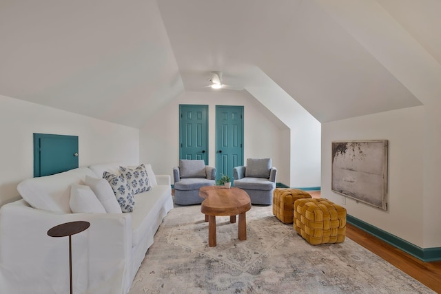 living room featuring hardwood / wood-style floors and lofted ceiling