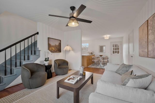 living room with hardwood / wood-style floors and ceiling fan