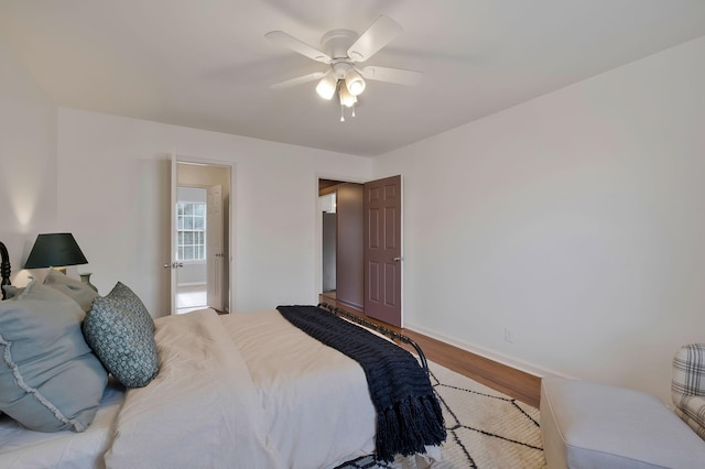 bedroom with light wood-type flooring and ceiling fan