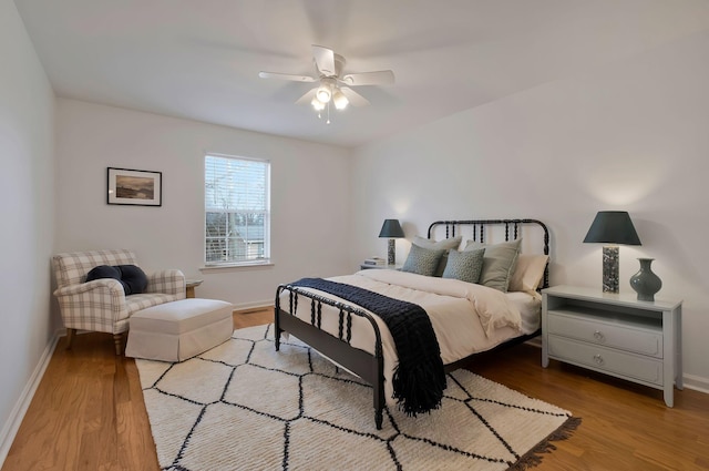 bedroom featuring ceiling fan and light hardwood / wood-style flooring