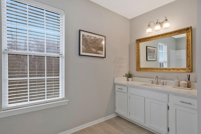 bathroom with tile patterned flooring and vanity