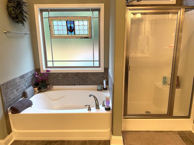 bathroom featuring plus walk in shower