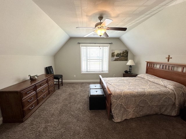 carpeted bedroom with a textured ceiling, vaulted ceiling, and ceiling fan