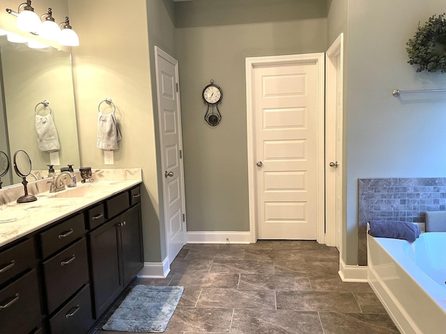 bathroom featuring vanity and a bathing tub