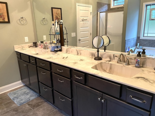 bathroom featuring tile patterned floors, vanity, and plus walk in shower