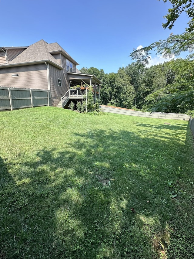 view of yard featuring a deck