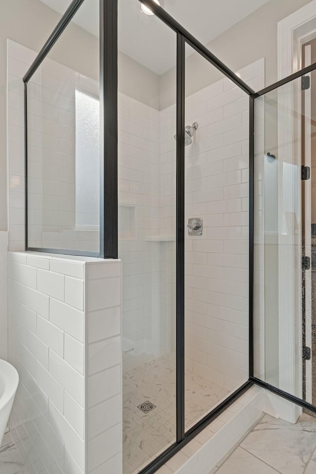 bathroom featuring an enclosed shower