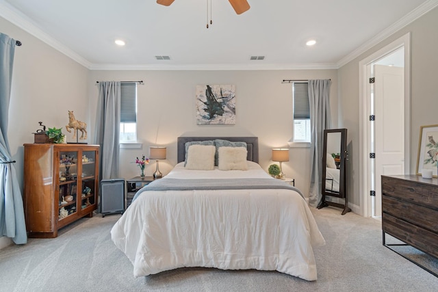 bedroom with ceiling fan, ornamental molding, and light carpet