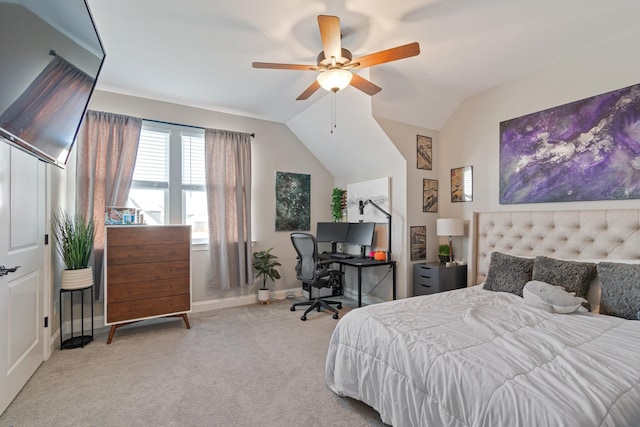 carpeted bedroom featuring lofted ceiling and ceiling fan