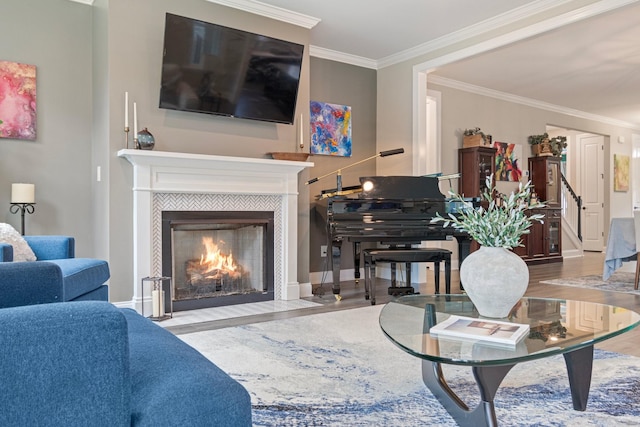 living room featuring ornamental molding and a fireplace