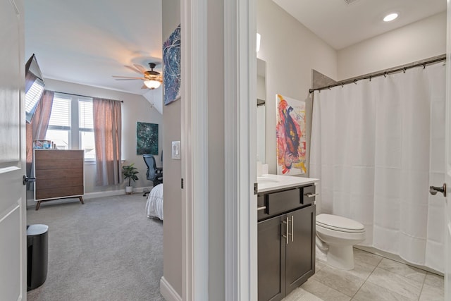 bathroom with a shower with curtain, ceiling fan, vanity, and toilet