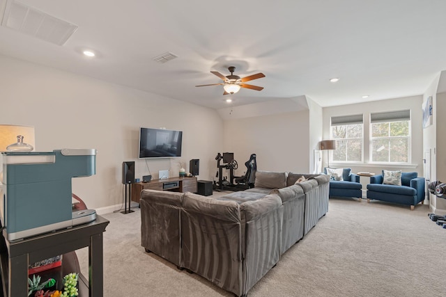 carpeted living room featuring vaulted ceiling and ceiling fan