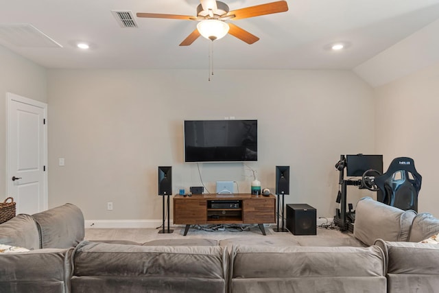 living room featuring lofted ceiling, carpet floors, and ceiling fan