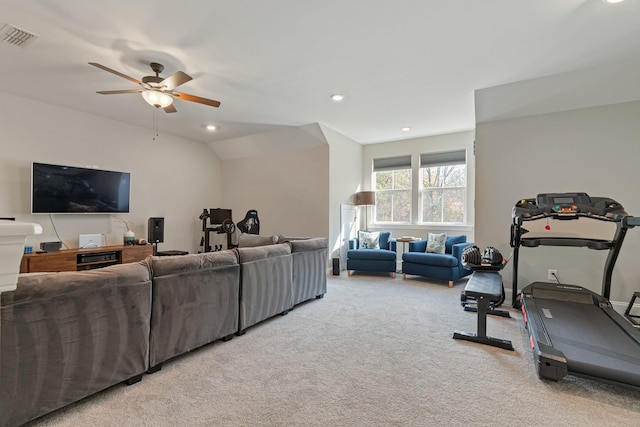 workout area with ceiling fan, light colored carpet, and lofted ceiling