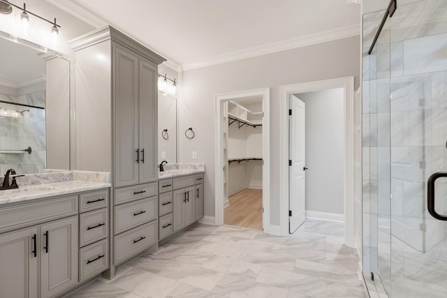 bathroom with vanity, an enclosed shower, and ornamental molding