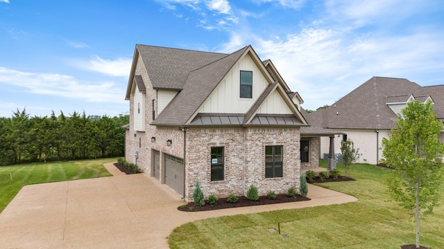 view of front of house featuring a front yard and a garage