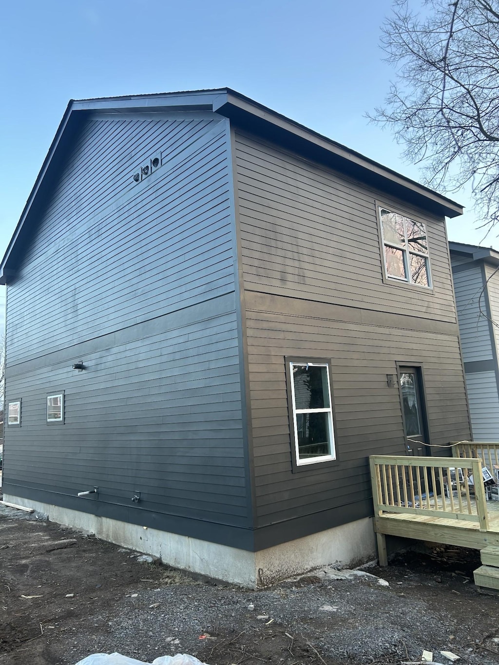 view of property exterior featuring a deck