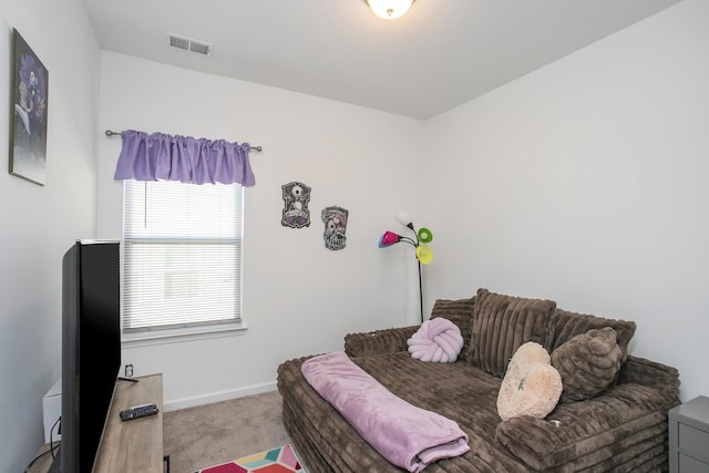 bedroom featuring light colored carpet